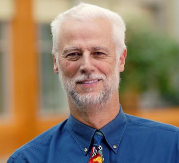 Richard Ladner. He is wearing a button down blue shirt and colorful tie