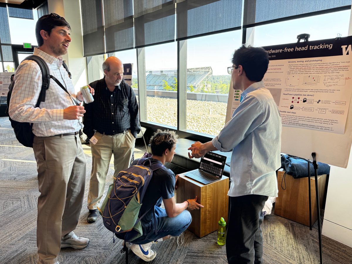 Student researcher Tanmay Kulkarni discusses his project, HeadTrace with attendees.

