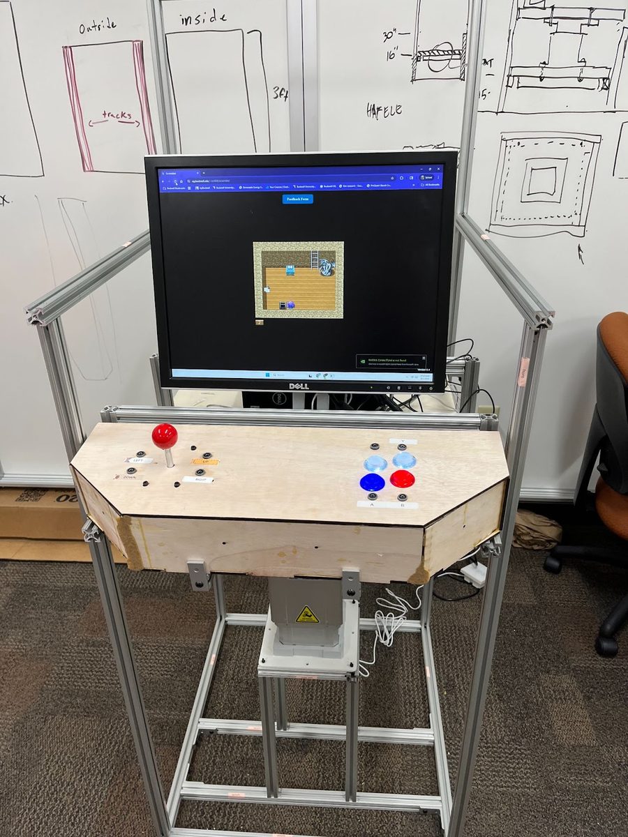 A front facing view of the finalized ARTcade with the monitor mounted atop the internal wooden platform